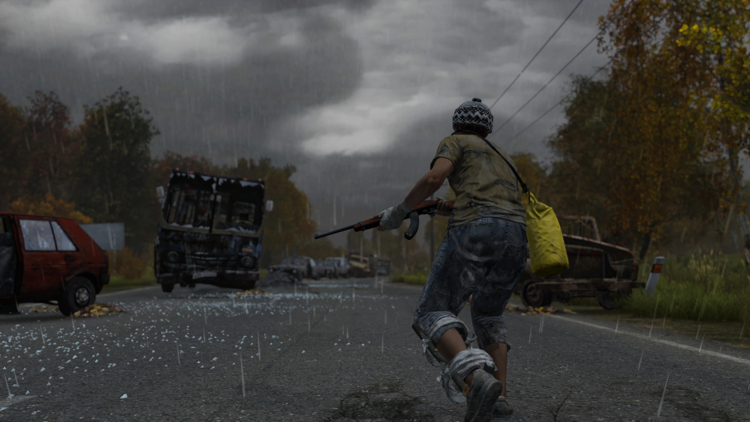 Official DayZ screenshot with a survivor running through the rain
