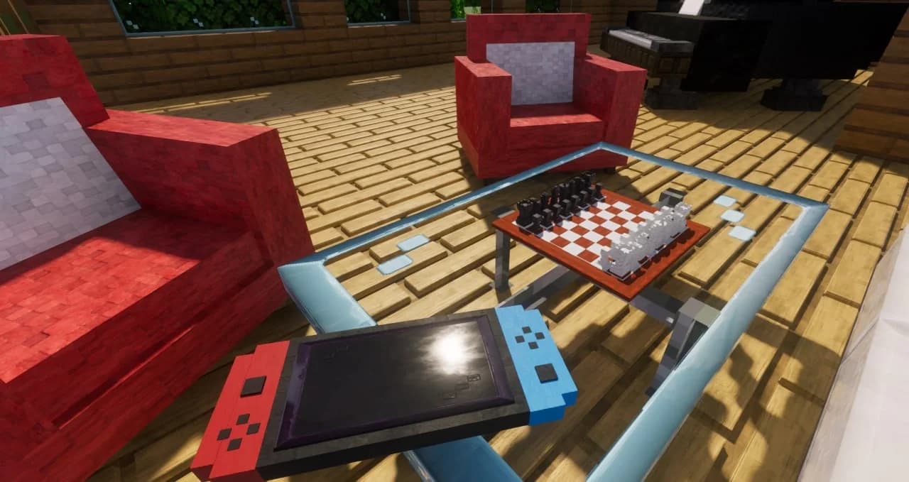 Chess and a handheld console on a glass table in a Minecraft home